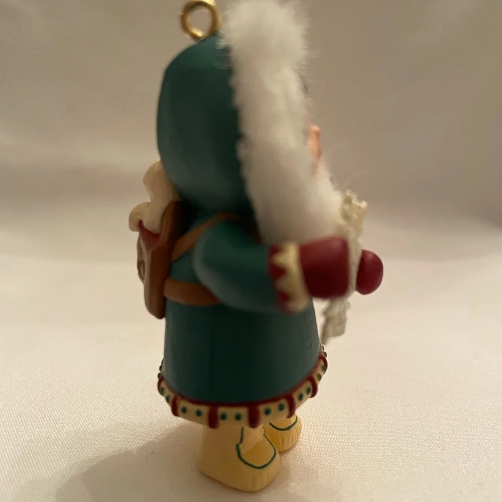Hallmark Ornament - Girl in Teal and White with Red Accents. EUC in original box